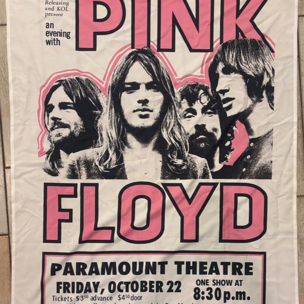 Pink Floyd concert tapestry with black and pink graphic of four men